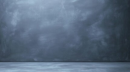 A plain, empty gray surface and wall, resembling a chalkboard or studio background with subtle texture.