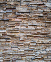 Stratified Sandstone Rock with Tones of Brown, Tan, and Grey.
