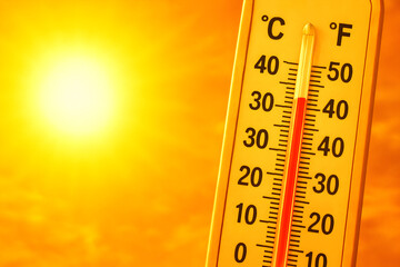 Scorching Summer Heatwave: A Simple Composition in Orange Hues Illustrating Extreme Temperatures in °C and °F, Reaching Up to 50°C and Beyond, Ideal for Visualizing Summer's Intense Heat.