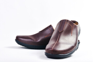 Brown leather slippers isolated on white background