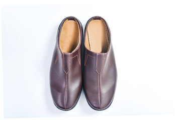 Brown leather slippers isolated on white background