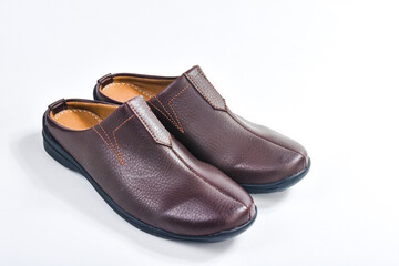 Brown leather slippers isolated on white background