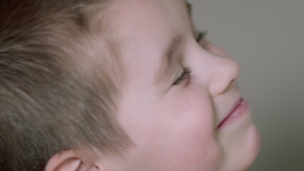 A Joyful Child Smiling Brightly with Delight and Happiness in a Cheerful Environment