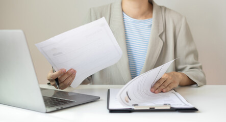 Business woman employer holding resume hiring recruit looking cv resume to hire candidates, analyzing information before job interview. Recruitment concepts