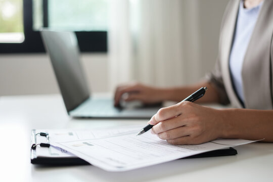 Business woman employer holding resume hiring recruit looking cv resume to hire candidates, analyzing information before job interview. Recruitment concepts