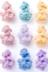 Nine colorful smoke plumes arranged in a grid against a white background