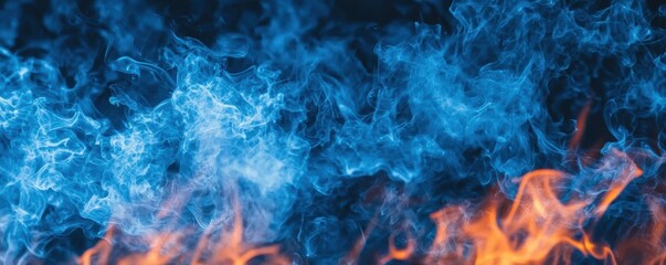 Fototapeta premium A vibrant blend of blue smoke and orange flames, creating a striking contrast against a dark background.
