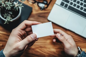 Obraz premium flawless image of man holding his business card and calling the contact number on it