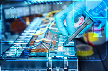 Technician soldering lithium-ion battery. Sustainable energy storage technology for renewable power...