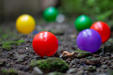 Still life photography of colorful plastic balls arranged in playful composition