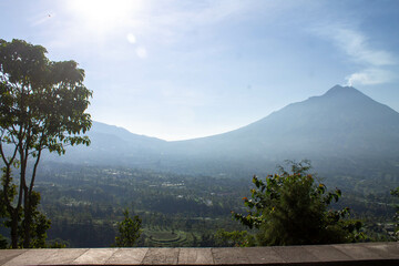 Idyllic rural mountain landscape photo with scenic hills and lush greenery