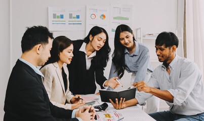 Team of financial advisory services. Asian advisor showing plan of investment to clients in the consultancy office..