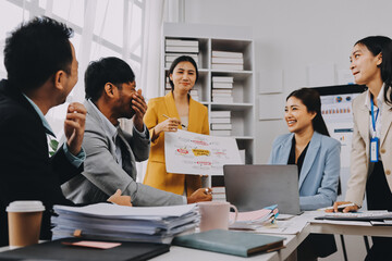 Team of financial advisory services. Asian advisor showing plan of investment to clients in the consultancy office..