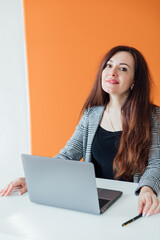 businesswoman working at desk in office online