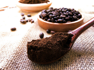 coffee powder and beans in a spoon