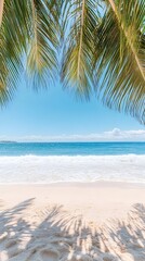 Lush palm fronds frame a pristine beach scene with white sand, gentle waves, and a clear blue sky