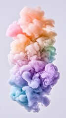 Obraz premium A vibrant, vertical plume of pastel-colored ink swirls and billows against a soft, light gray background