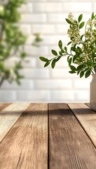 A wooden tabletop with a blurry background of a white brick wall and a potted plant