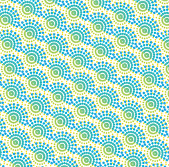 Seamless pattern with blue and yellow circles on a white background