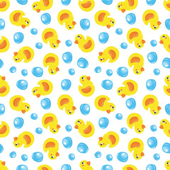 Seamless pattern with a rubber duck and soap bubbles. For kids design  On a blue background.