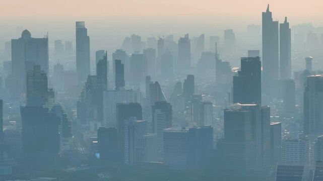 Urban skyline shrouded in haze as air pollution blankets the city during early morning hours