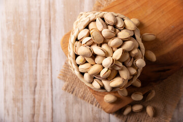 Pistachios in a bowl. Pistachios are the seeds of the Pistacia vera tree, a healthy food rich in antioxidants, vitamins, and minerals. They are consumed as a snack or as an ingredient in many recipes.