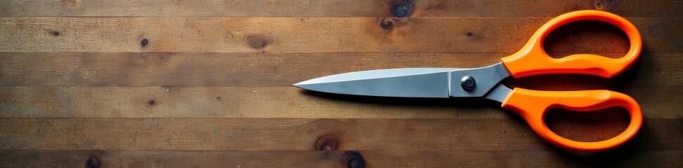 Obraz premium Top view of versatile kitchen scissors on wooden table, cooking, multipurpose