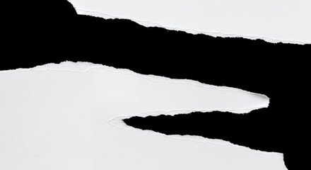 Torn paper revealing black space with rough edges, abstract design concept. Textured white paper ripped apart, creating a visual separation with negative space.