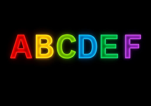 A colorful neon sign featuring the letters ABCDEF, showcasing a playful and vibrant design ideal for creative projects and visual appeal.