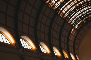 Architectural Grandeur Vaulted Ceiling with Windows in a Classic Building Interior.