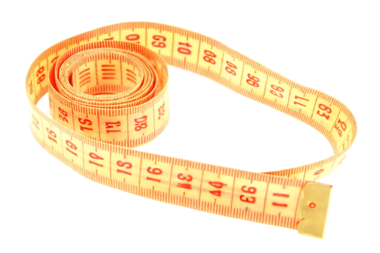 Yellow Fabric Measuring Tape Rolled Up Close Up Studio Shot