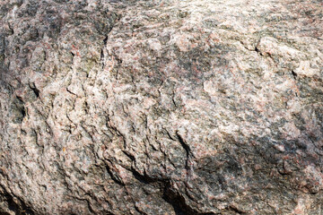This is a close up view of a rock showcasing a lot of texture and detail