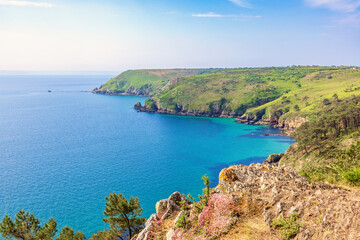 Fototapeta premium Rocky coastline by the sea a beautiful sunny summer day