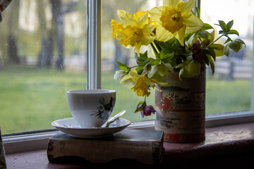 Vintage Tin Vase and Teacup on Sunny Windowsill