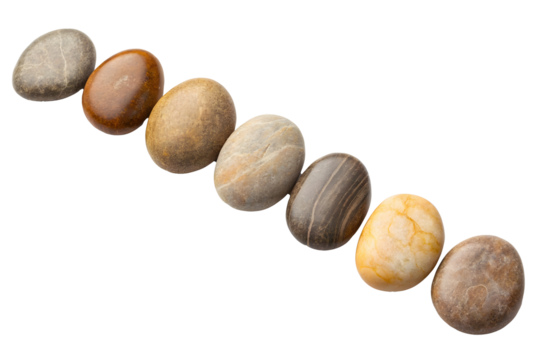 Seven smooth river rocks arranged in a diagonal line on a solid black background