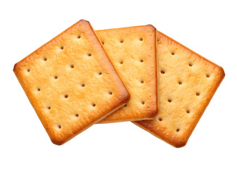 Three golden square crackers freshly baked with a dark black background isolated