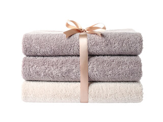 Luxurious stack of freshly laundered towels tied with an elegant ribbon for spa or gift