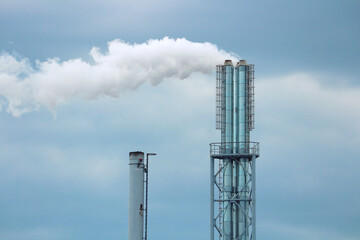 Industrial Pipes Against a Sky Background
