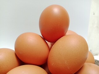 a pile of eggs with a white background