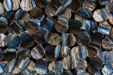 Stack of cut steel rods with an overheated steel structure