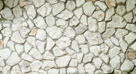 White masonry stone wall background pattern. Wall of an old building or castle