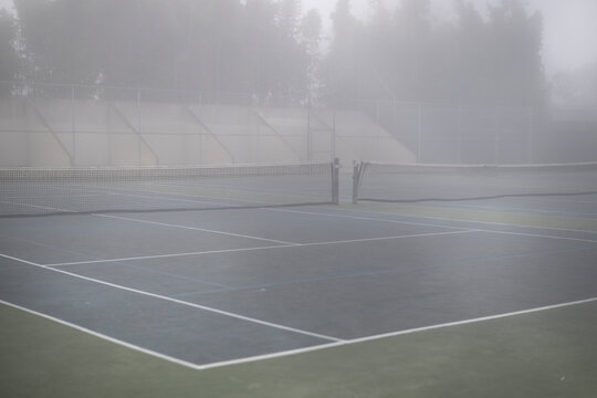 Tennis and raquetball court desolate in murky fog