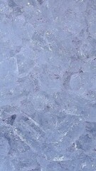 Crystal Clear Ice Cubes Close Up with Delicate Texture and Natural Reflections in Frosty Background