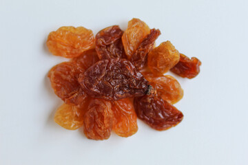 Scattered raisins on isolated white background