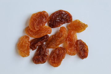 Scattered raisins on isolated white background