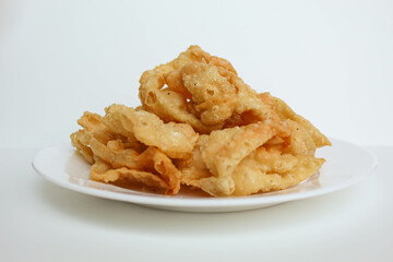 Kerupuk pangsit, or crispy fried skin dumpling, isolated in white background