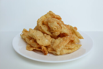 Kerupuk pangsit, or crispy fried skin dumpling, isolated in white background