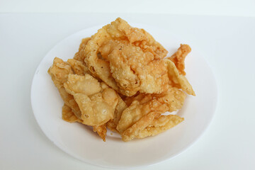 Kerupuk pangsit, or crispy fried skin dumpling, isolated in white background