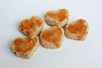 Peanut cookies in love shape, isolated on white background