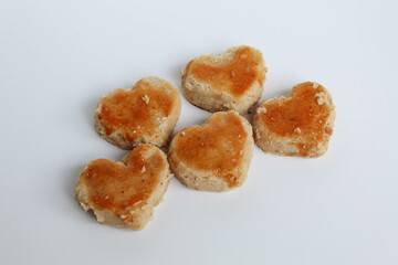 Peanut cookies in love shape, isolated on white background